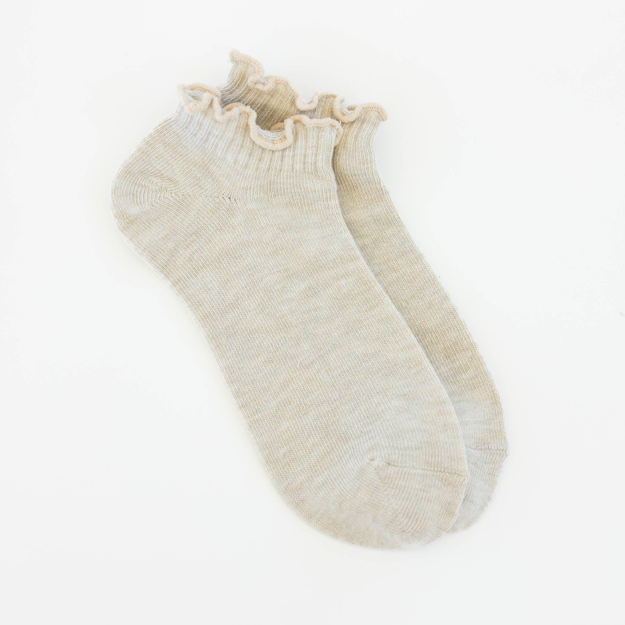 Women's heather oatmeal low-cut socks featuring a soft ruffle cuff made from a lightweight modal blend for everyday comfort.