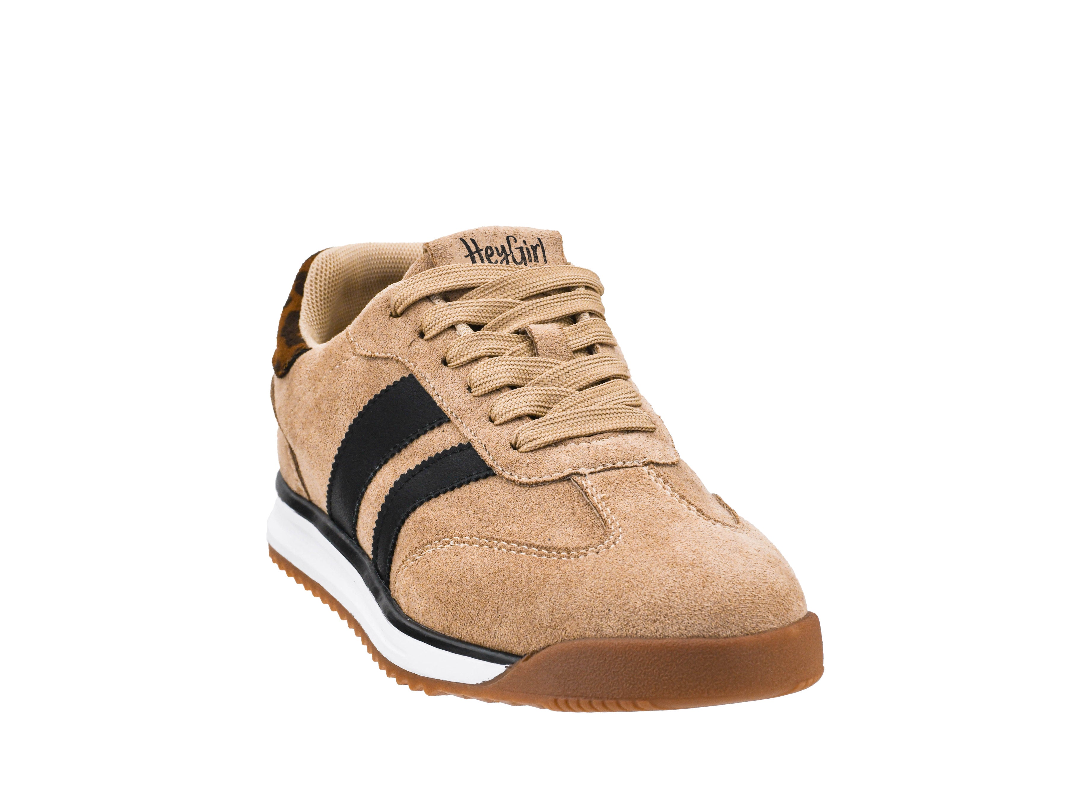 Beige sneaker with black stripe and white sole on a white background