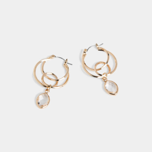 Gold hoop earrings with teardrop-shaped gemstones on a white background