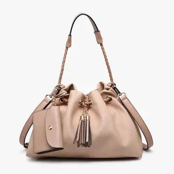 Handbag with a strap and decorative elements on a white background