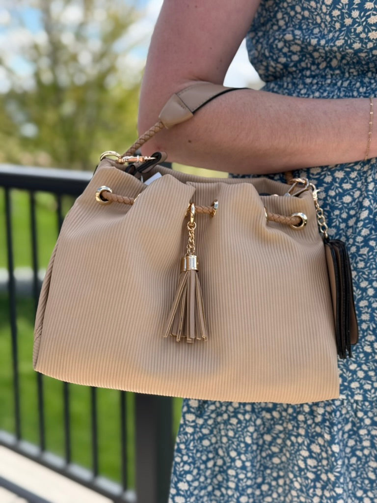 Taupe pleated Aaliyah bucket bag crossbody purse with braided drawstring and tassel charm