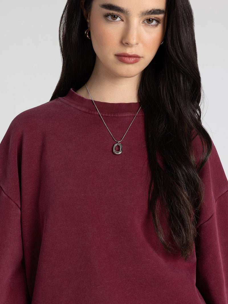 Ashford Sweatshirt in zinfandel — close-up of round neckline and fabric detail