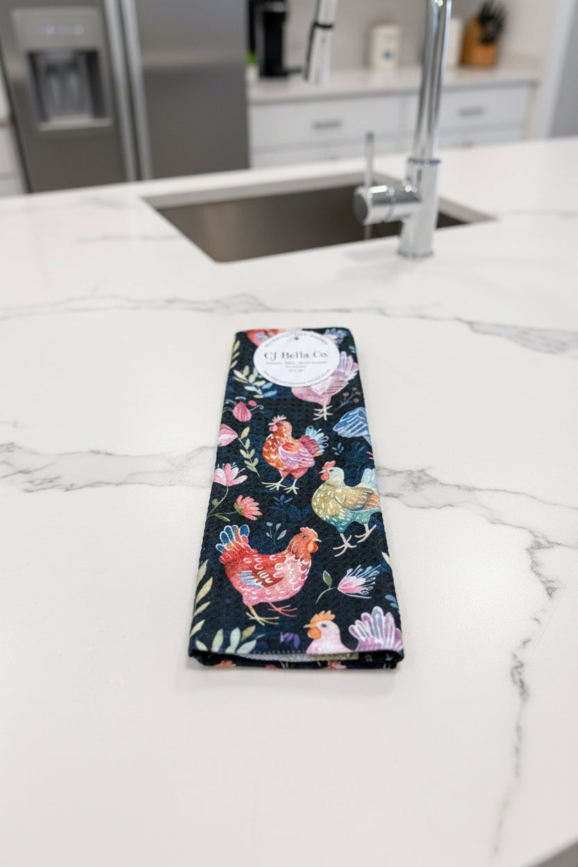 Eco-friendly waffle weave washcloth featuring colorful watercolor chickens and wildflowers on a navy blue background.