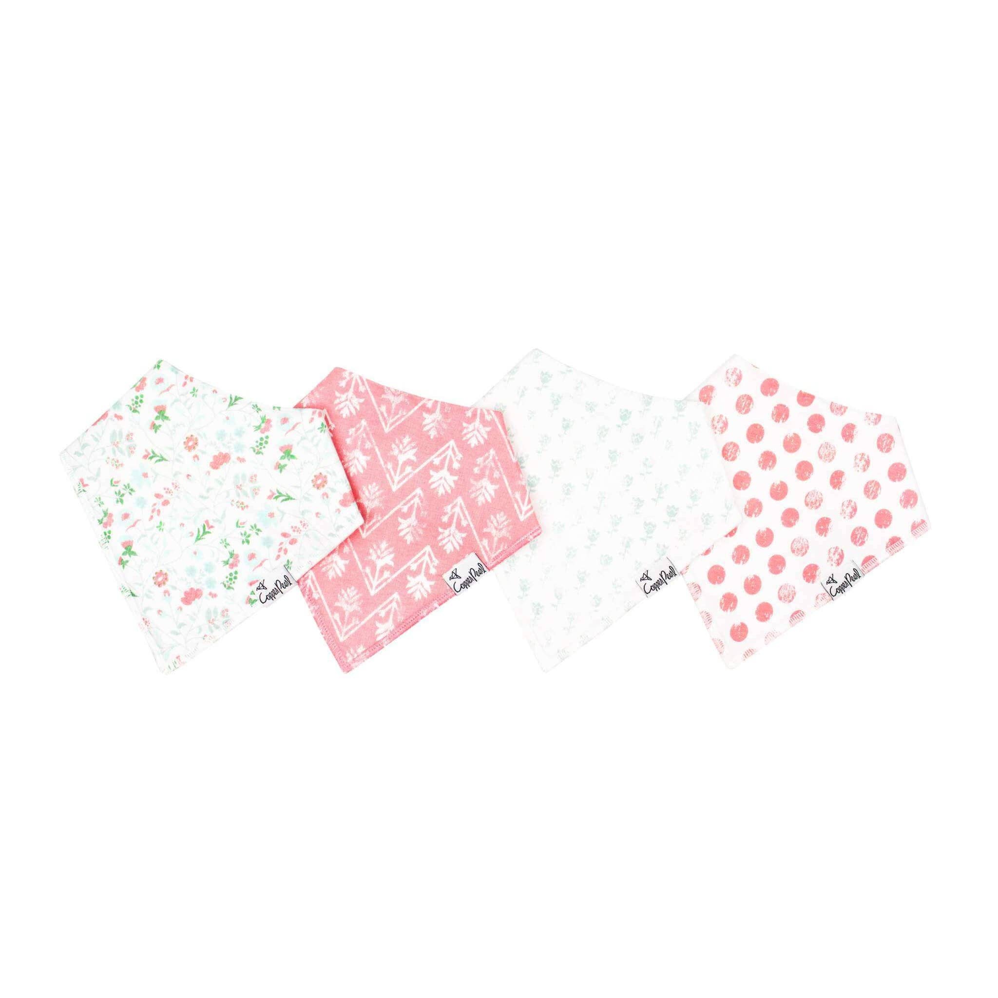 Copper Pearl Claire 4-pack baby bandana bib set featuring floral and pink polka dot prints with absorbent cotton and fleece backing.