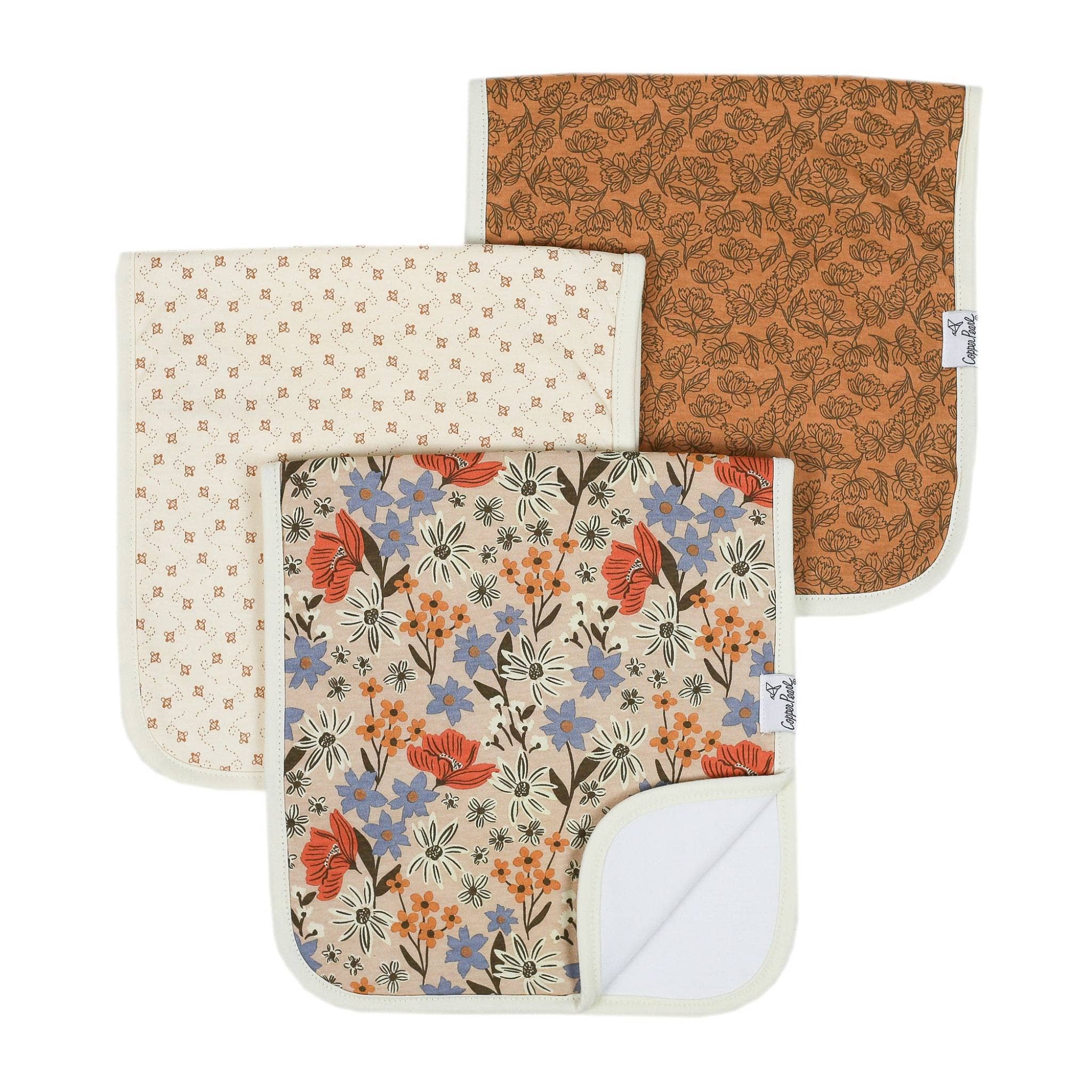 Copper Pearl Eden 3-pack premium baby burp cloths featuring coordinating floral and botanical prints with soft cotton construction.