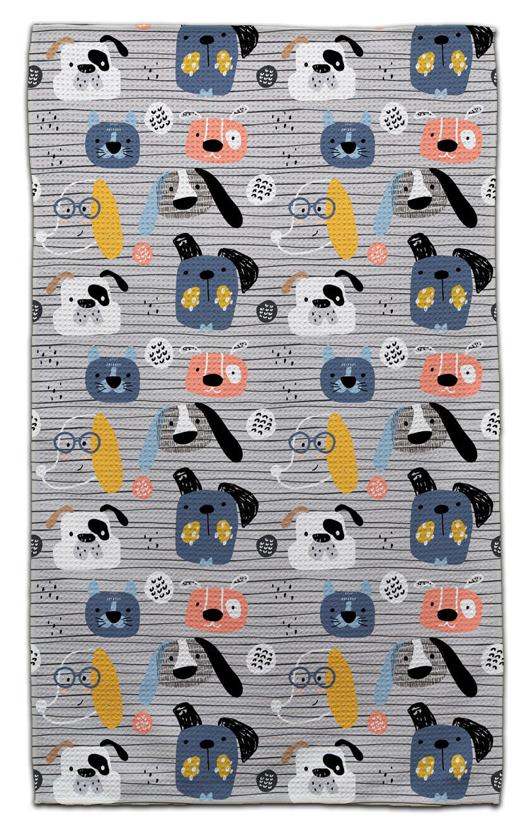 Dog-themed eco-friendly waffle weave kitchen towel with colorful illustrated puppy faces by CJ Bella