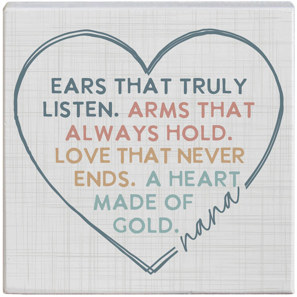 Ears That Listen Nana Wood Sign by Sincere Surroundings — 5.25" square pine wood sign with a linen-textured background featuring a hand-drawn heart outline and the colorful sentiment "Ears that truly listen. Arms that always hold. Love that never ends. A heart made of gold." with "nana" in script at the bottom