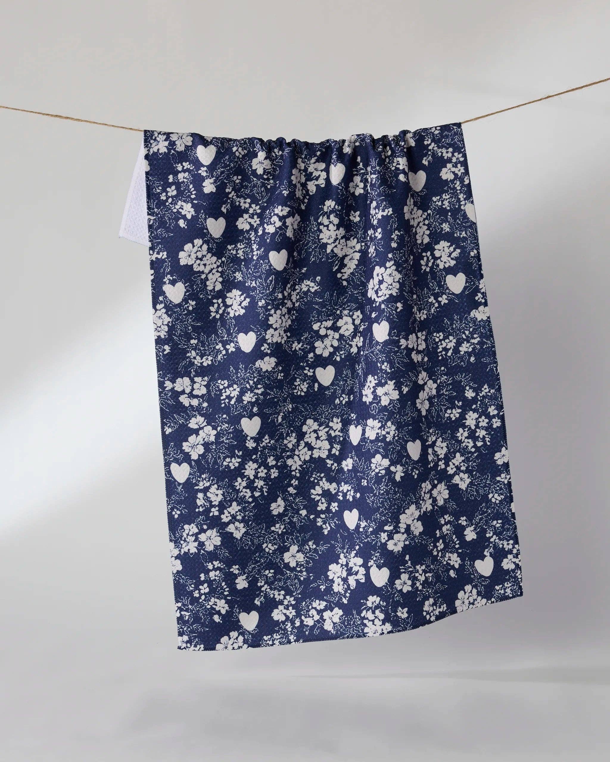 Geometry Midnight Posy Tea Towel — navy Geoweave™ kitchen towel with white floral and heart pattern, 18x30 inches, made from post-consumer recycled materials
