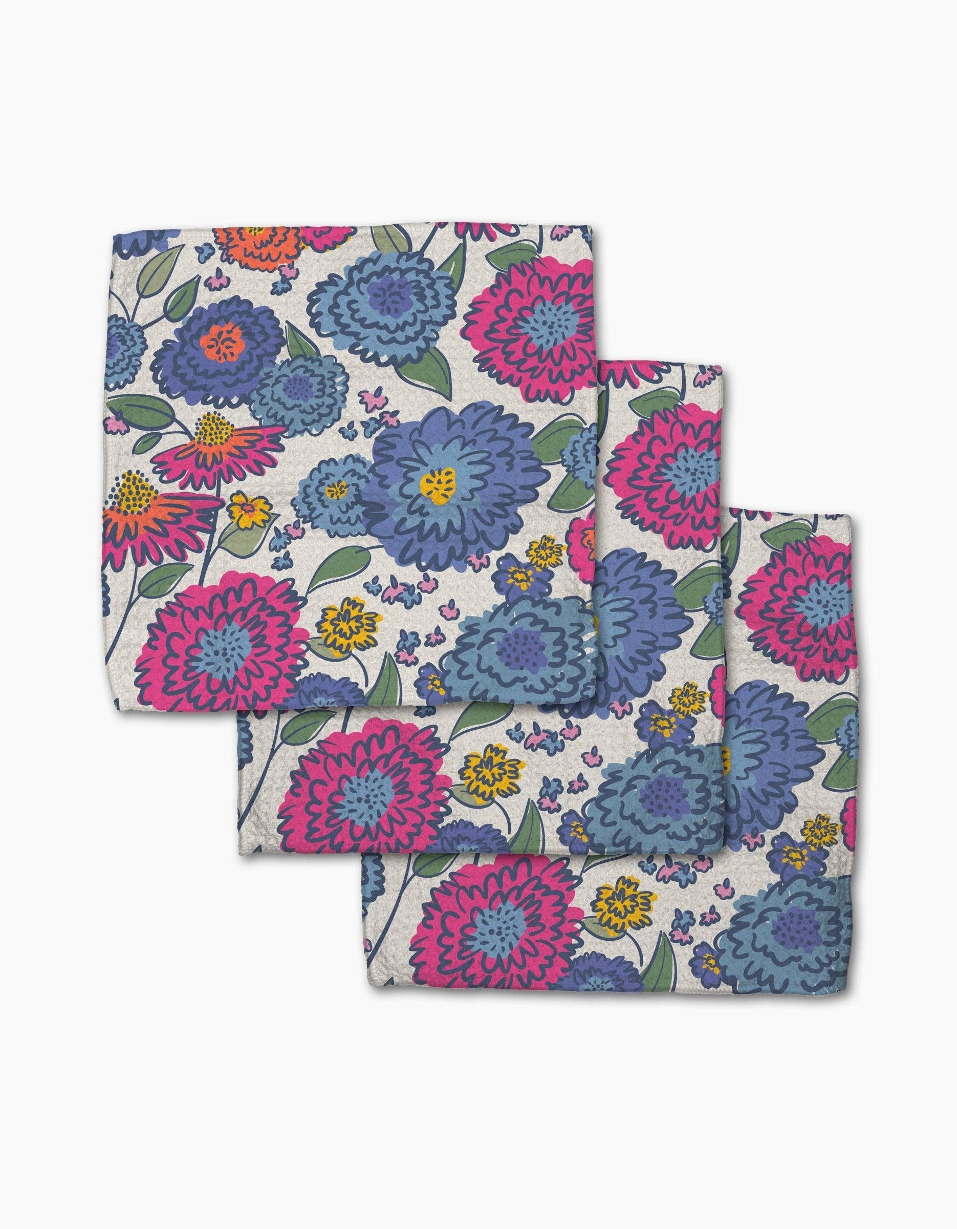 Geometry Painterly Meadow floral dishcloth set featuring colorful pink, blue, purple, and orange flowers on reusable Geoweave™ fabric