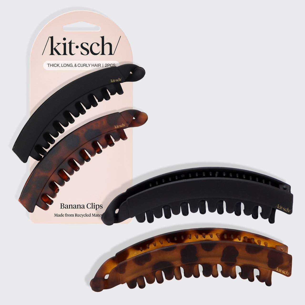 Kitsch Banana Hair Clips 2-pack in black and tortoise shell made from recycled plastic for thick, long, and curly hair.