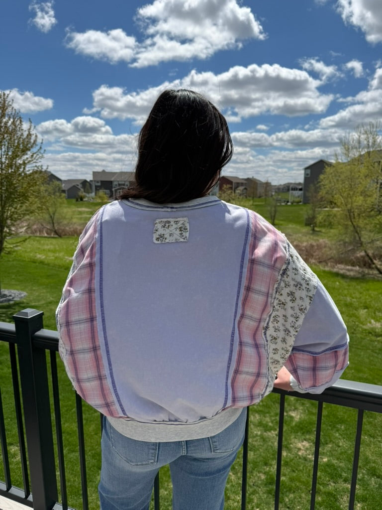 Woman wearing lavender mixed fabric mineral washed oversized dolman sweatshirt top
