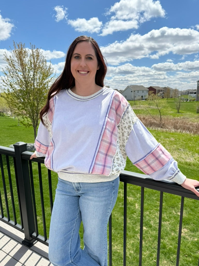 Woman wearing lavender mixed fabric mineral washed oversized dolman sweatshirt top