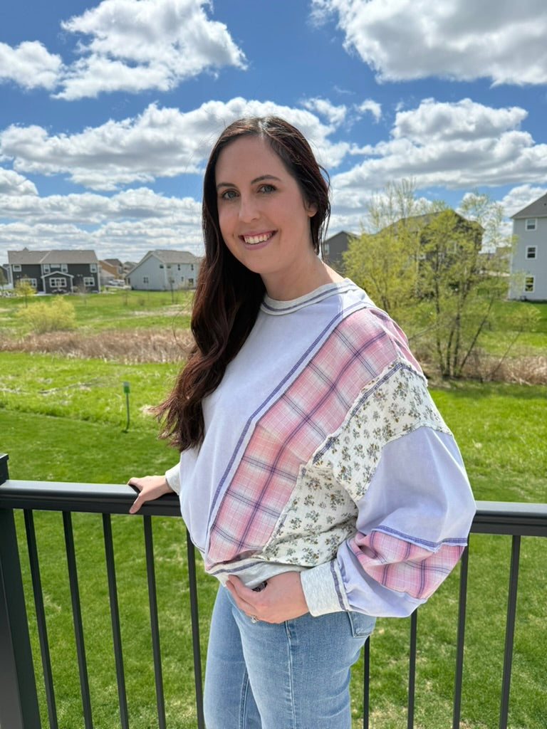 Woman wearing lavender mixed fabric mineral washed oversized dolman sweatshirt top