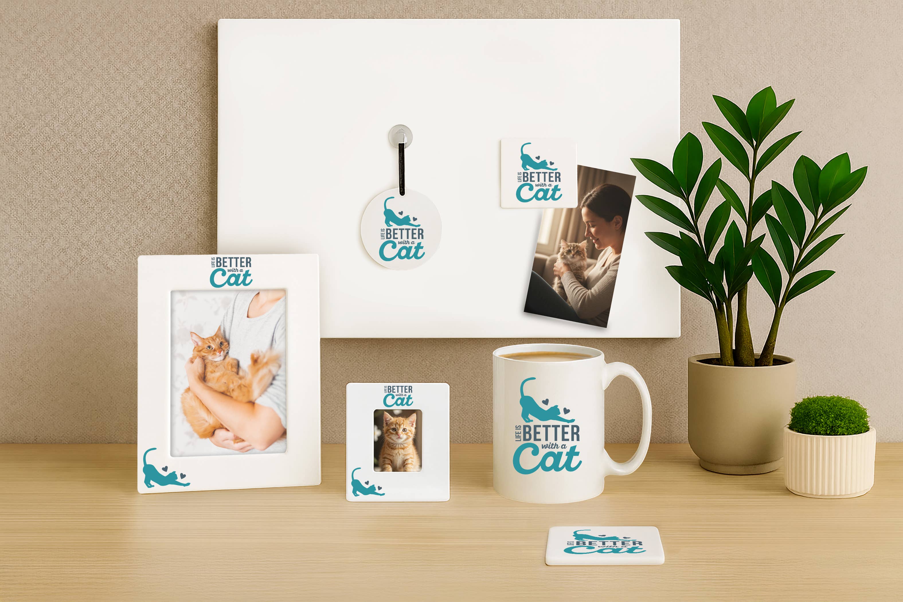 Collection of 'Better Cat' branded products including frames, a mug, and coasters on a desk.