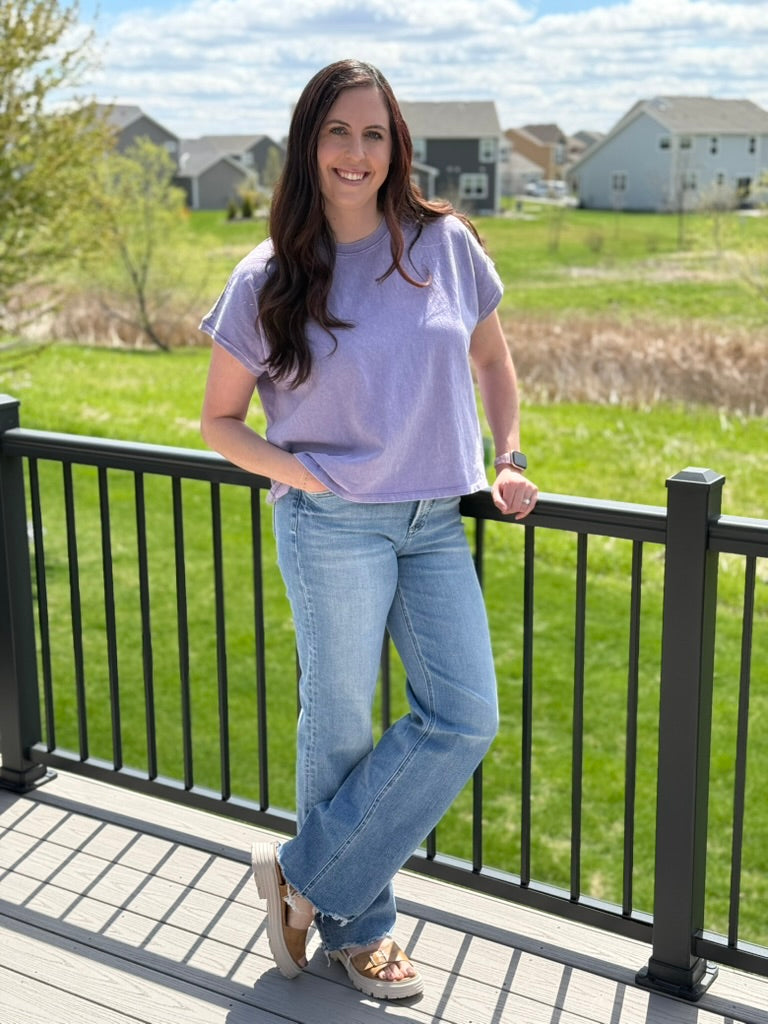 Woman wearing purple mineral wash capped sleeve relaxed fit cotton t-shirt