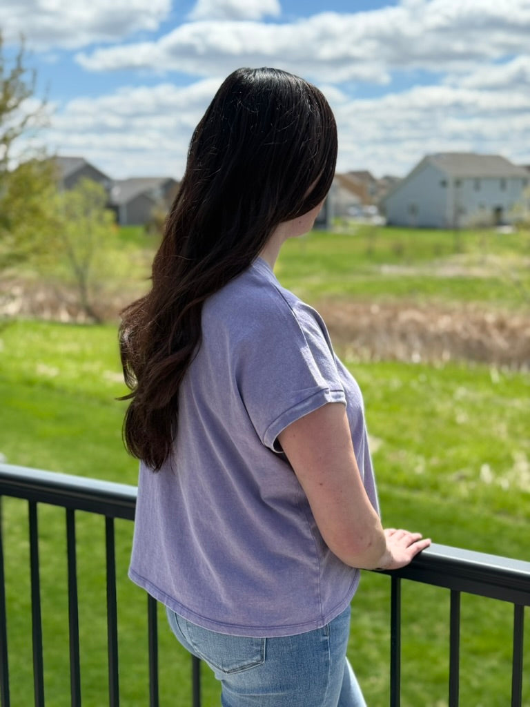 Woman wearing purple mineral wash capped sleeve relaxed fit cotton t-shirt