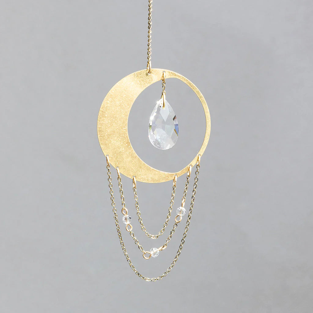 Scout Curated Wears Crescent Moon Balance mini crystal suncatcher featuring gold moon design with crystal prism and rainbow reflections