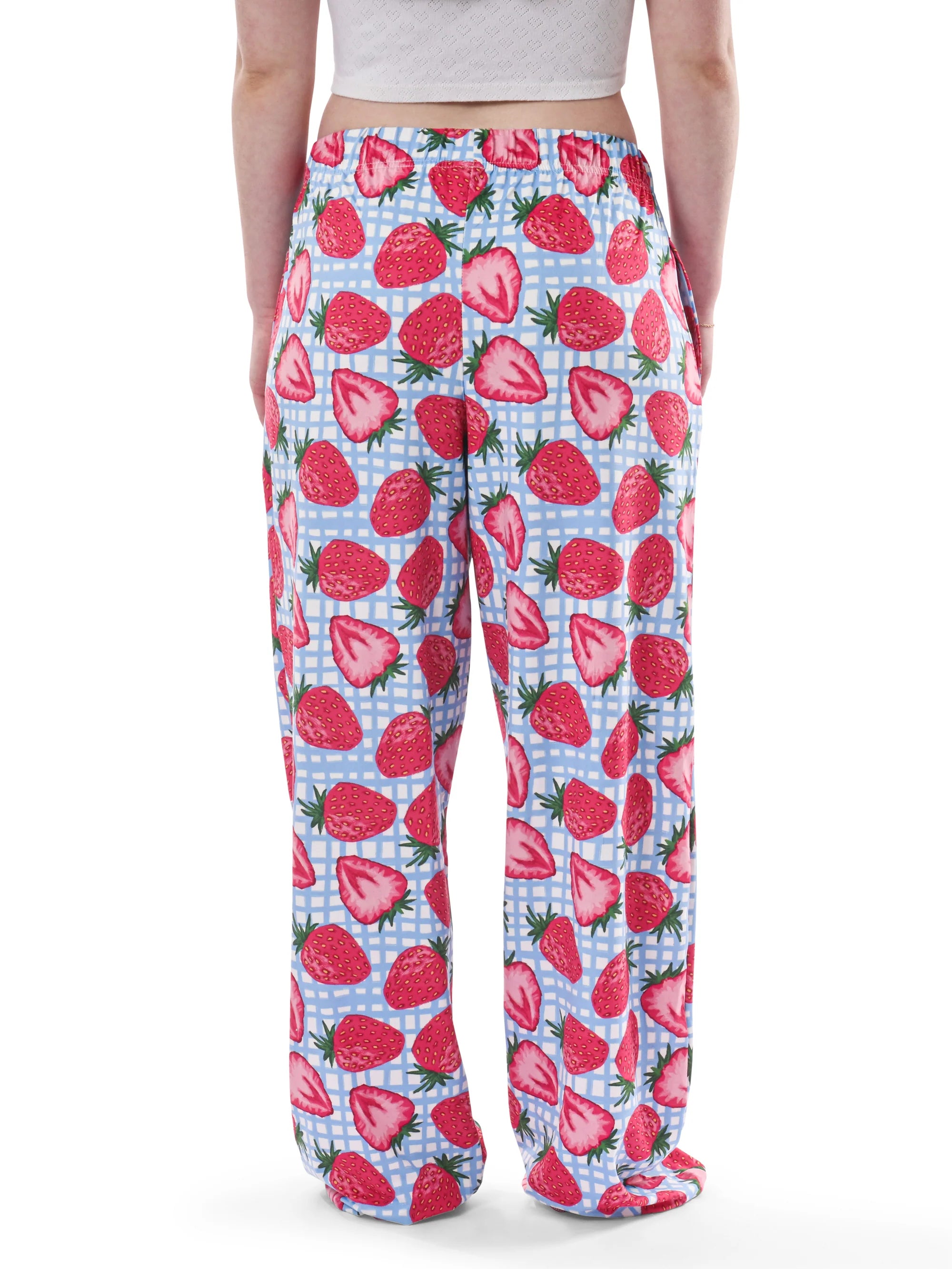 Pajama pants with strawberry pattern on a white background
