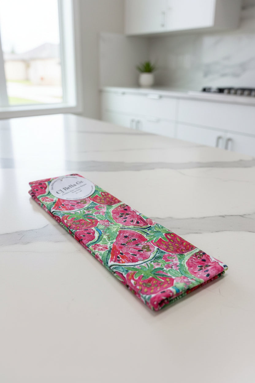 Eco-friendly waffle weave washcloth featuring colorful watercolor strawberries, watermelon slices, and green leaves on a bright summer-inspired design.