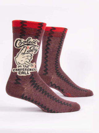 Pair of burgundy Blue Q crew socks with red cuffs, black zigzag pattern, and Coolest Guy on the Conference Call graphic