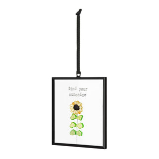 Find Your Sunshine Suncatcher by DEMDACO — side angle view showing the depth of the black metal floating frame with glass panels on both sides, sea glass sunflower visible inside, hung by a black ribbon