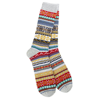 A pair of 1902 men's crew socks with a colorful Fair Isle pattern on a light gray background.