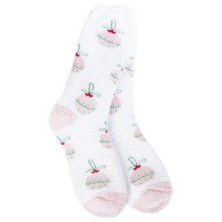 A pair of World's Softest women's white fuzzy crew socks with a repeating pattern of pink cupcakes decorated with green leaves and red bows, shown against a plain white background.