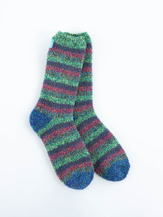 A pair of World's Softestfuzzy striped women's socks in green, blue, and red, displayed against a plain white background.