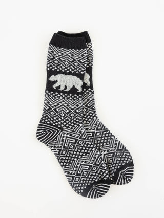 World's Softest black and white patterned crew sock with a white polar bear motif on the side, displayed against a plain white background.
