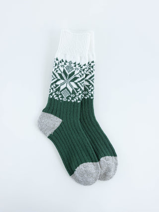 World's Softest women's green and white patterned sock on a light gray background