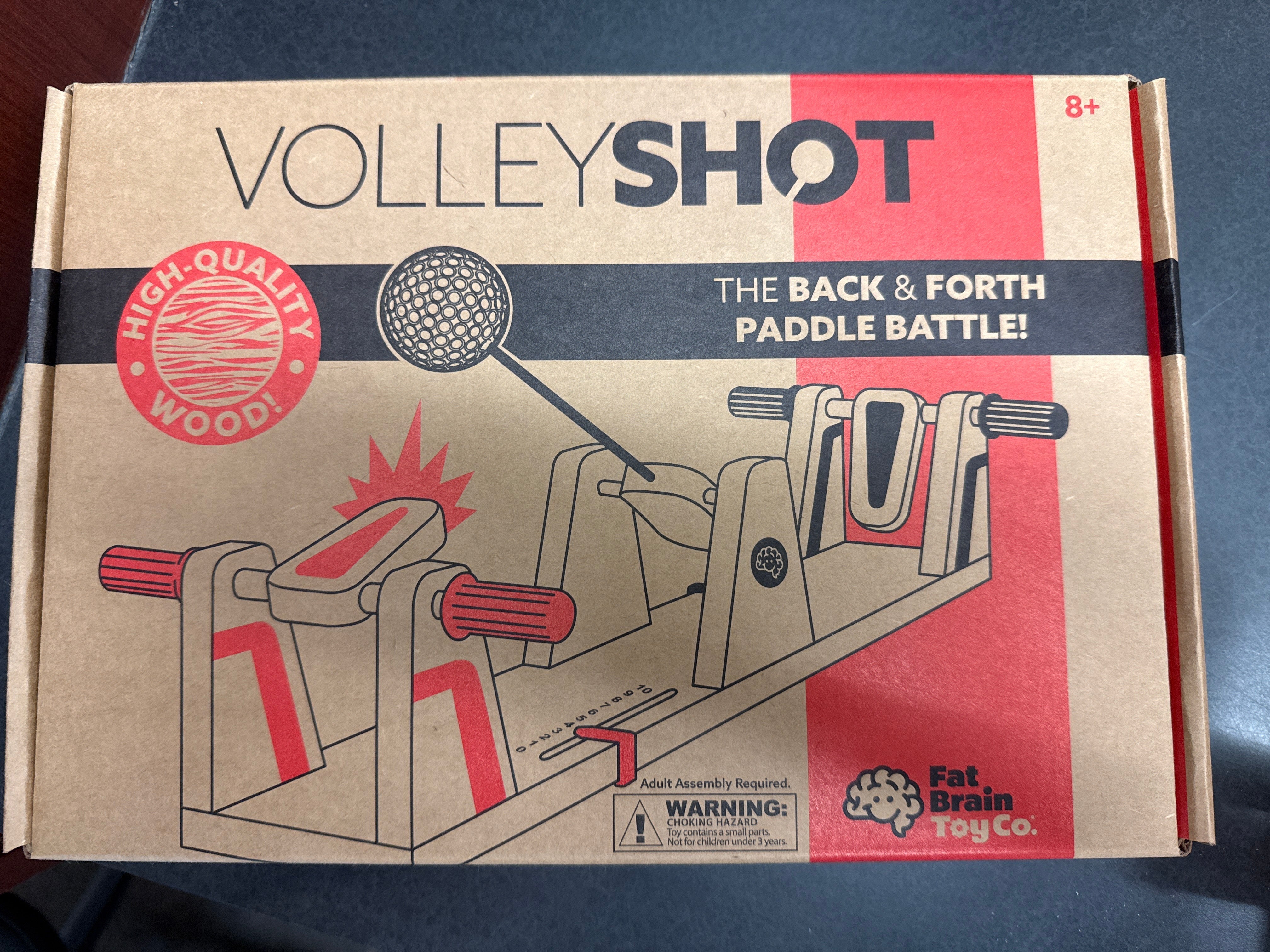 Box for 'VolleyShot' game by Fat Brain Toy Co on a dark surface