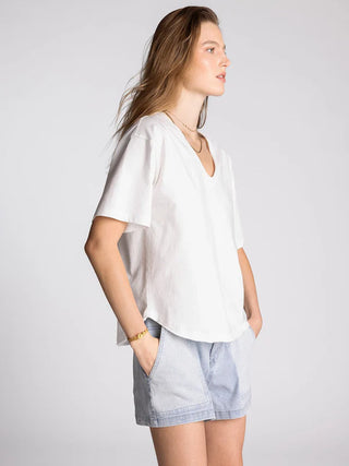 Tee in white — women's relaxed V-neck cotton t-shirt with raw-edged collar seaming side view