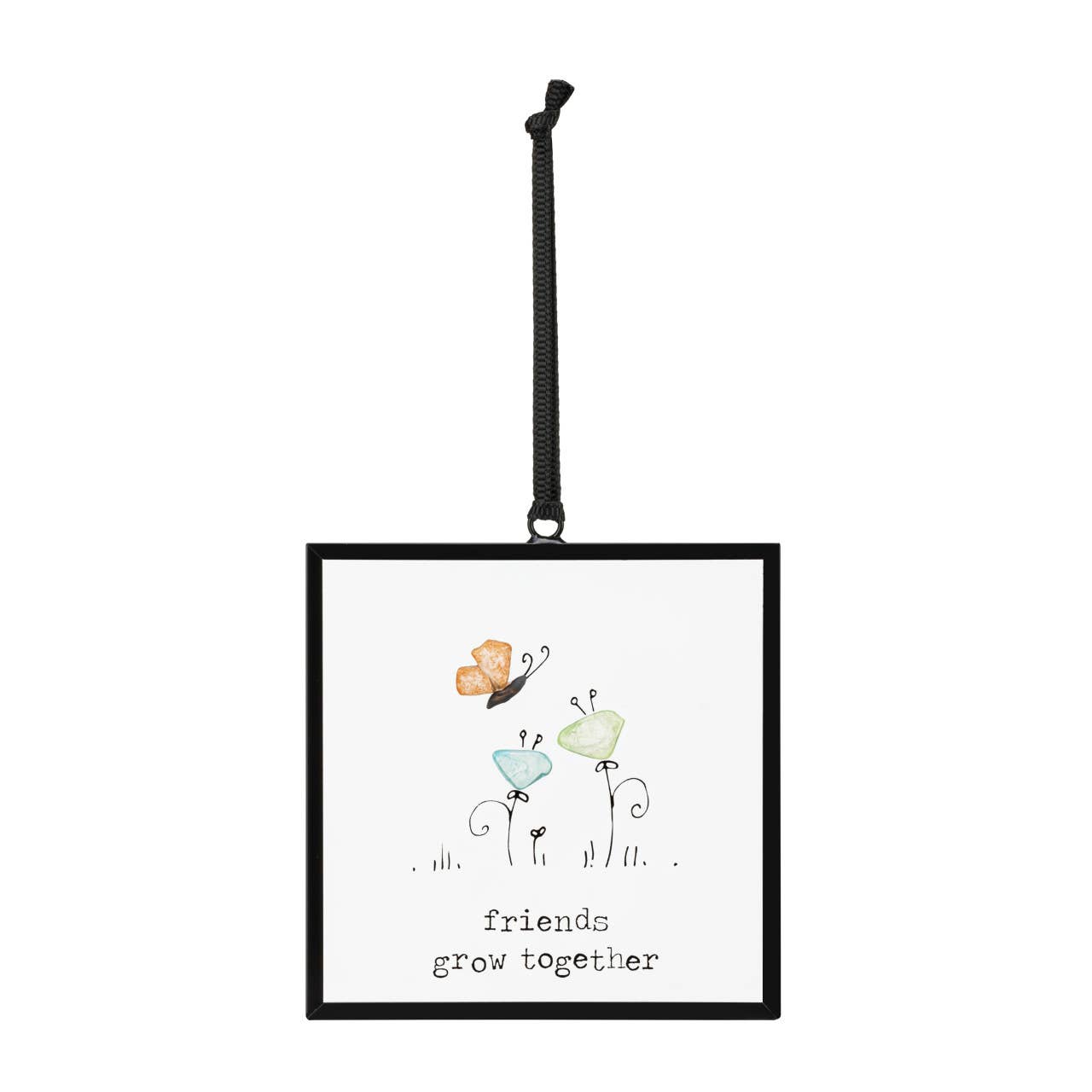 Friends Grow Together Suncatcher by DEMDACO — full view of the square black metal floating frame showing the sea glass butterfly and two sea glass flowers with "friends grow together" sentiment, hung by a black grosgrain ribbon against a white background