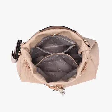 Handbag with open compartments on a white background
