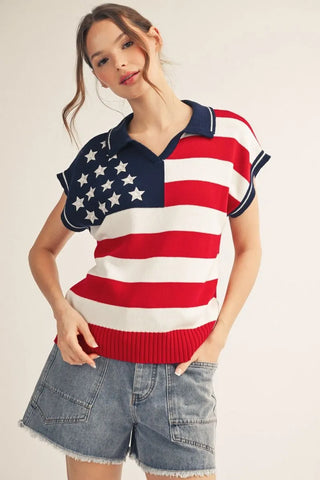woman wearing American flag sweater polo top with embroidered stars and denim shorts