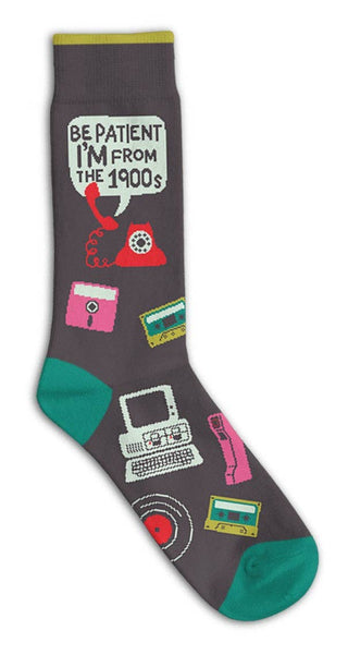 Funatic Be Patient I'm From the 1900s crew socks featuring retro graphics including a floppy disk, cassette tape, vintage computer, landline phone, and vinyl record.