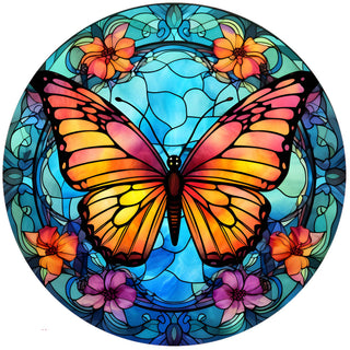 Butterfly Stained Glass Silicone Jar Opener by Andréas — round flexible silicone disc featuring a Tiffany-style stained glass design of a large monarch-style butterfly with vivid orange, pink, and golden yellow wings set against a luminous aqua blue background with intricate scrollwork and clusters of orange, red, and purple flowers