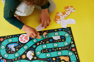 Catventures family board game by Petit Collage featuring colorful cat illustrations, wooden cat game pieces, and fun cat-themed gameplay for ages 4 and up.