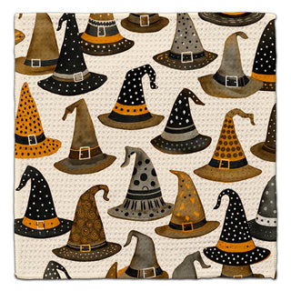 Halloween kitchen washcloth featuring whimsical witch hats in black, gray, gold and orange on a white background