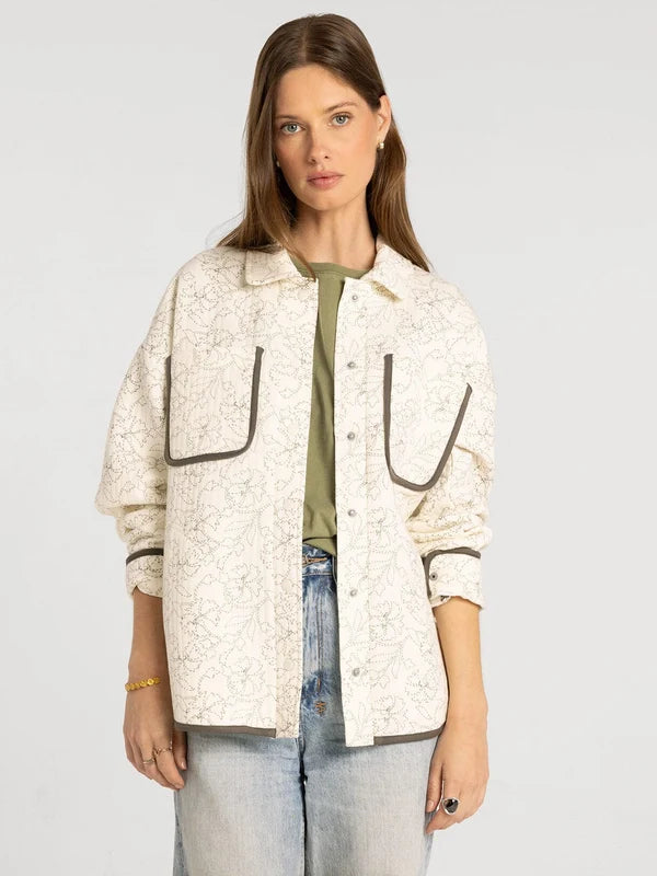  Claremont Jacket in ivory floral — women's cotton snap button jacket with collared neckline and contrast piping, front view