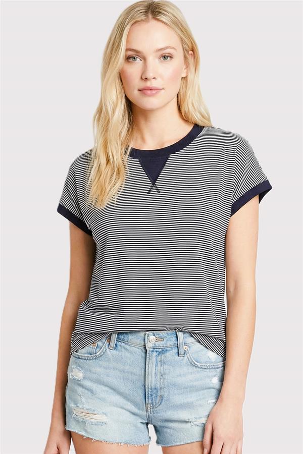 woman wearing navy color trimmed pinstripe top with contrast neckline and sleeves