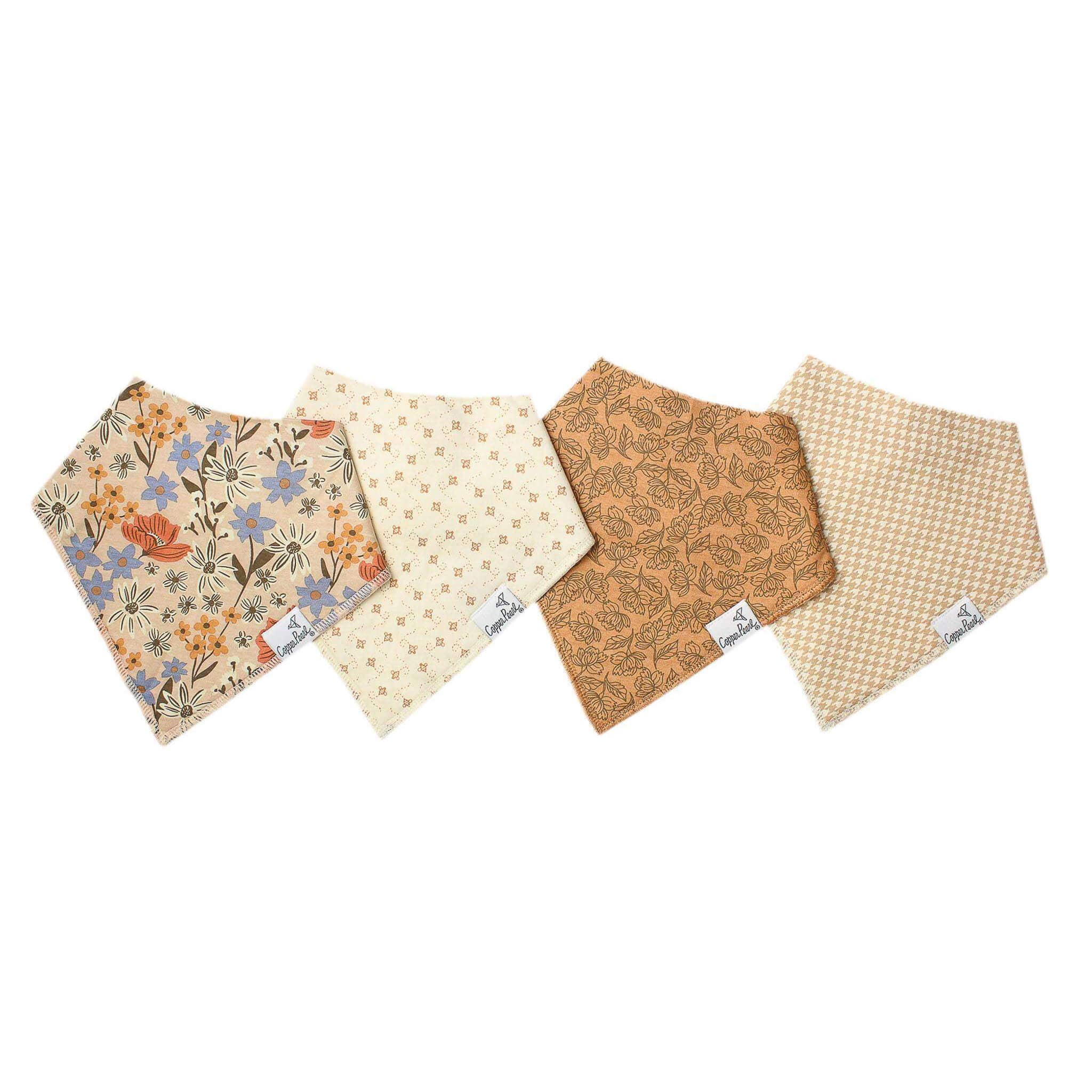 Copper Pearl Eden 4-pack baby bandana bib set featuring coordinating floral and neutral prints with absorbent cotton construction.