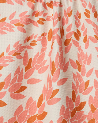 Coral and orange patterned eco-friendly kitchen tea towel by Geometry close-up