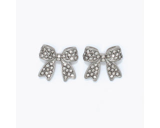 Fully pavé crystal-encrusted silver-tone bow stud earrings by Periwinkle — sparkling clear crystal bow studs in a feminine, on-trend design
