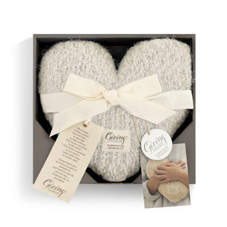 DEMDACO Cream Giving Heart Weighted Pillow presented in a charcoal gift box, tied with an ivory satin ribbon bow, with the Giving Collection sentiment tag