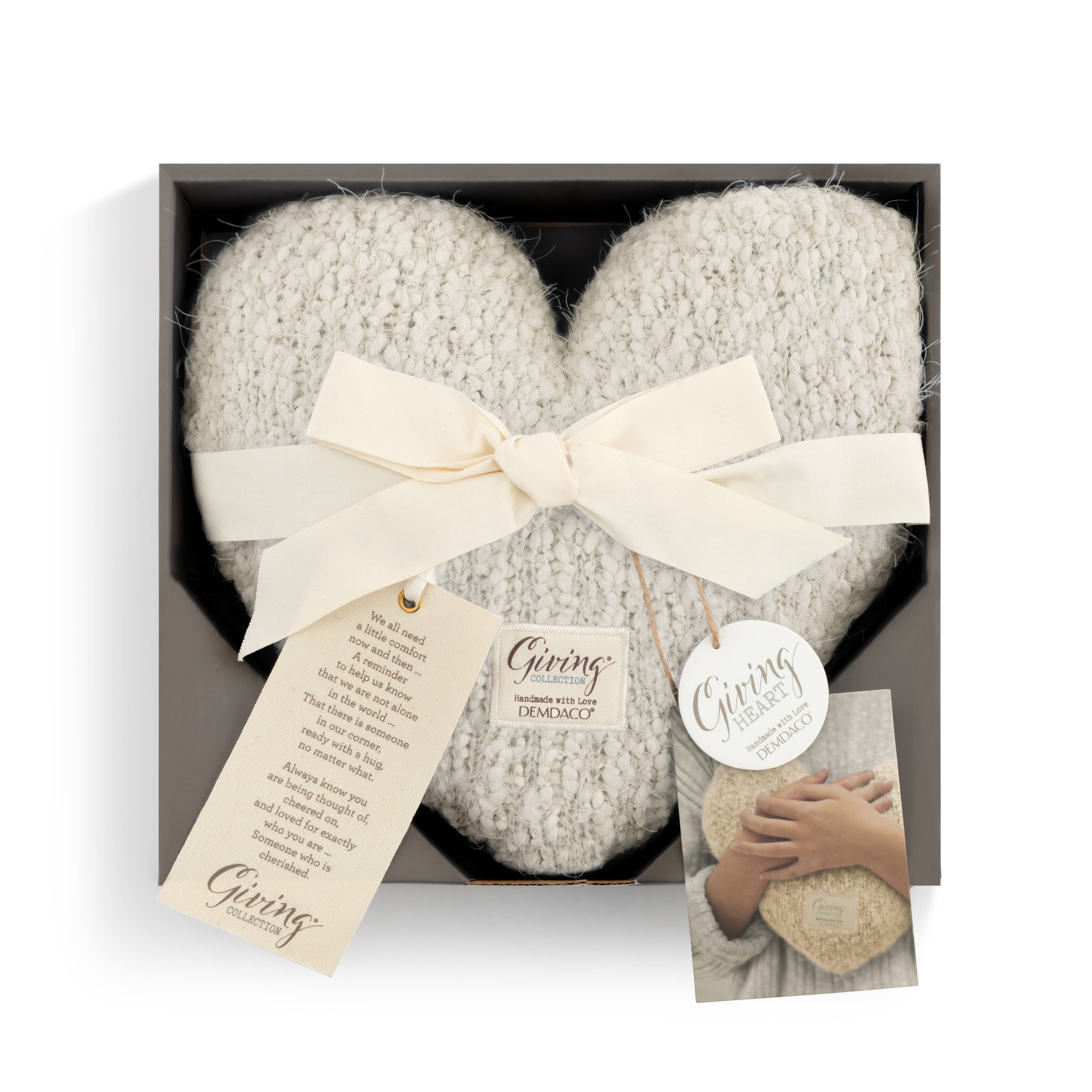 DEMDACO Cream Giving Heart Weighted Pillow presented in a charcoal gift box, tied with an ivory satin ribbon bow, with the Giving Collection sentiment tag