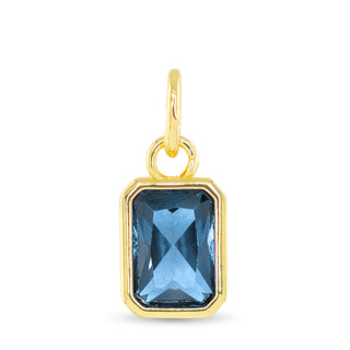 December birthstone charm with blue topaz-inspired faceted stone and 18K gold dipped setting