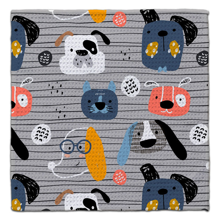 Dog-themed eco-friendly waffle weave washcloth with colorful illustrated puppy faces by CJ Bella