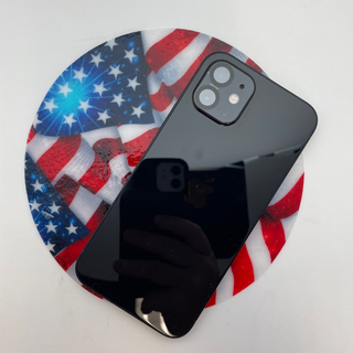 Phone sitting on American flag silicone jar opener on a white background