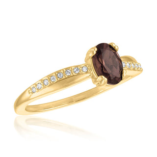 Gold-overlay ring with an oval smoky quartz center and clear accent stones